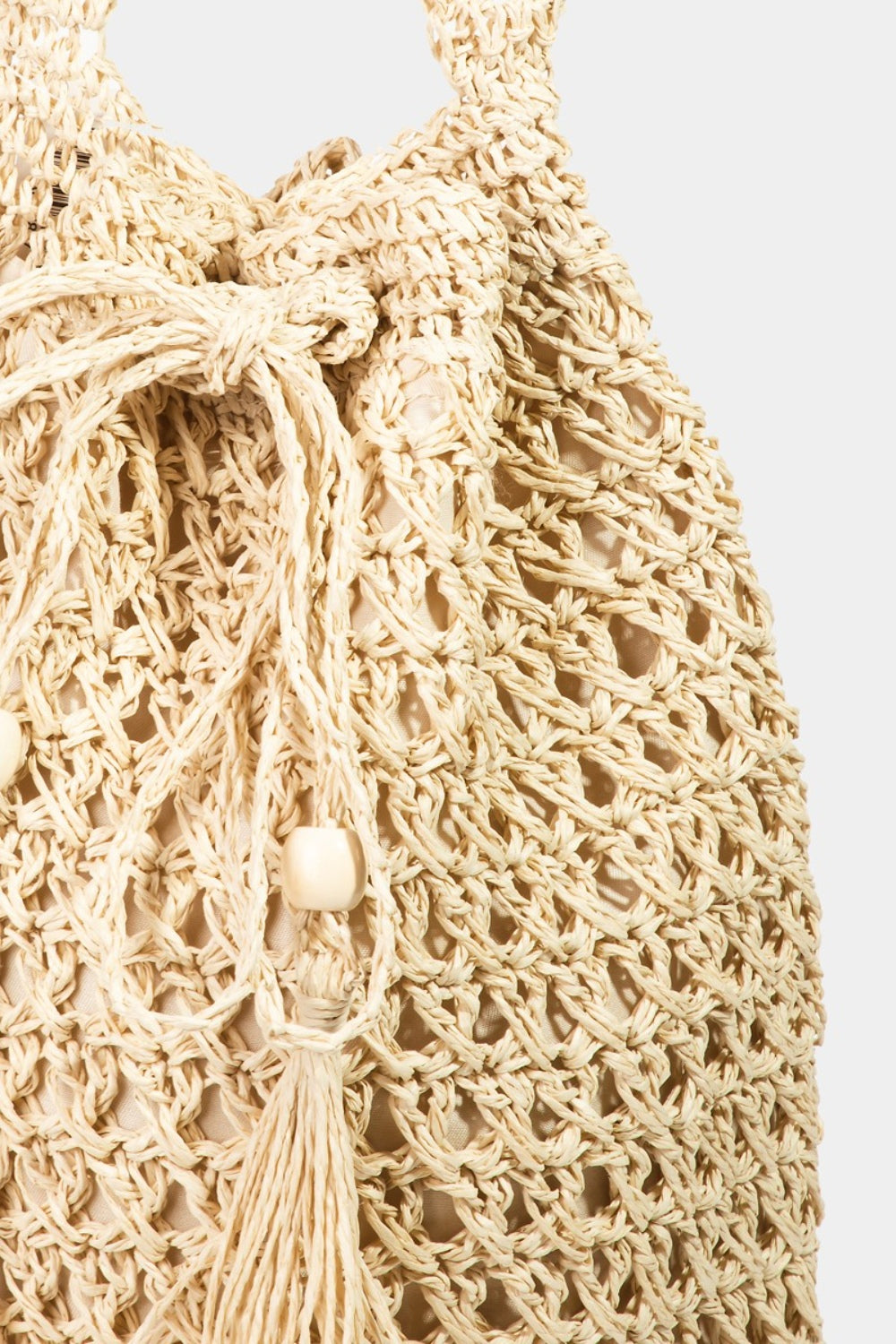 Fame Straw Braided Drawstring Tote Bag with Tassel  | KIKI COUTURE